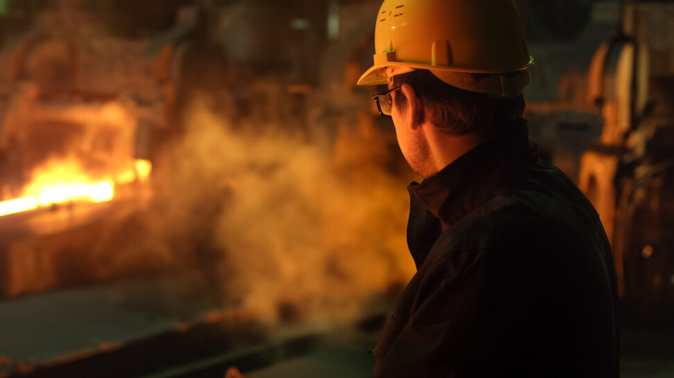 Technician in a foundry Portrait of a technician with hard hat in a foundry